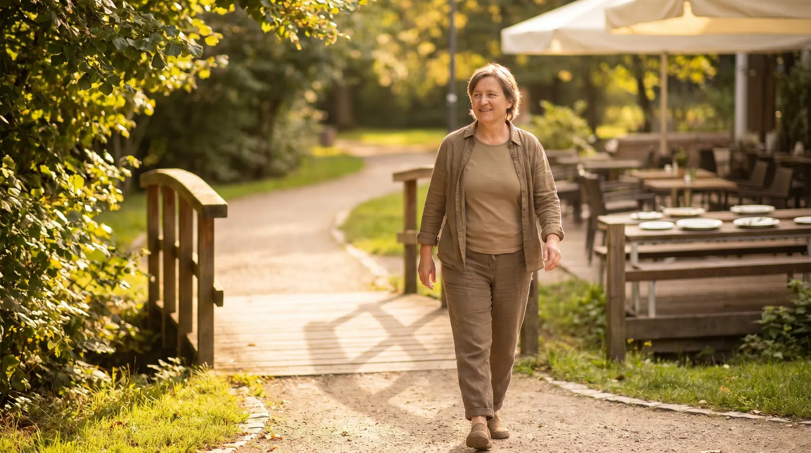 A person taking a light walk in a quiet neighborhood after a meal